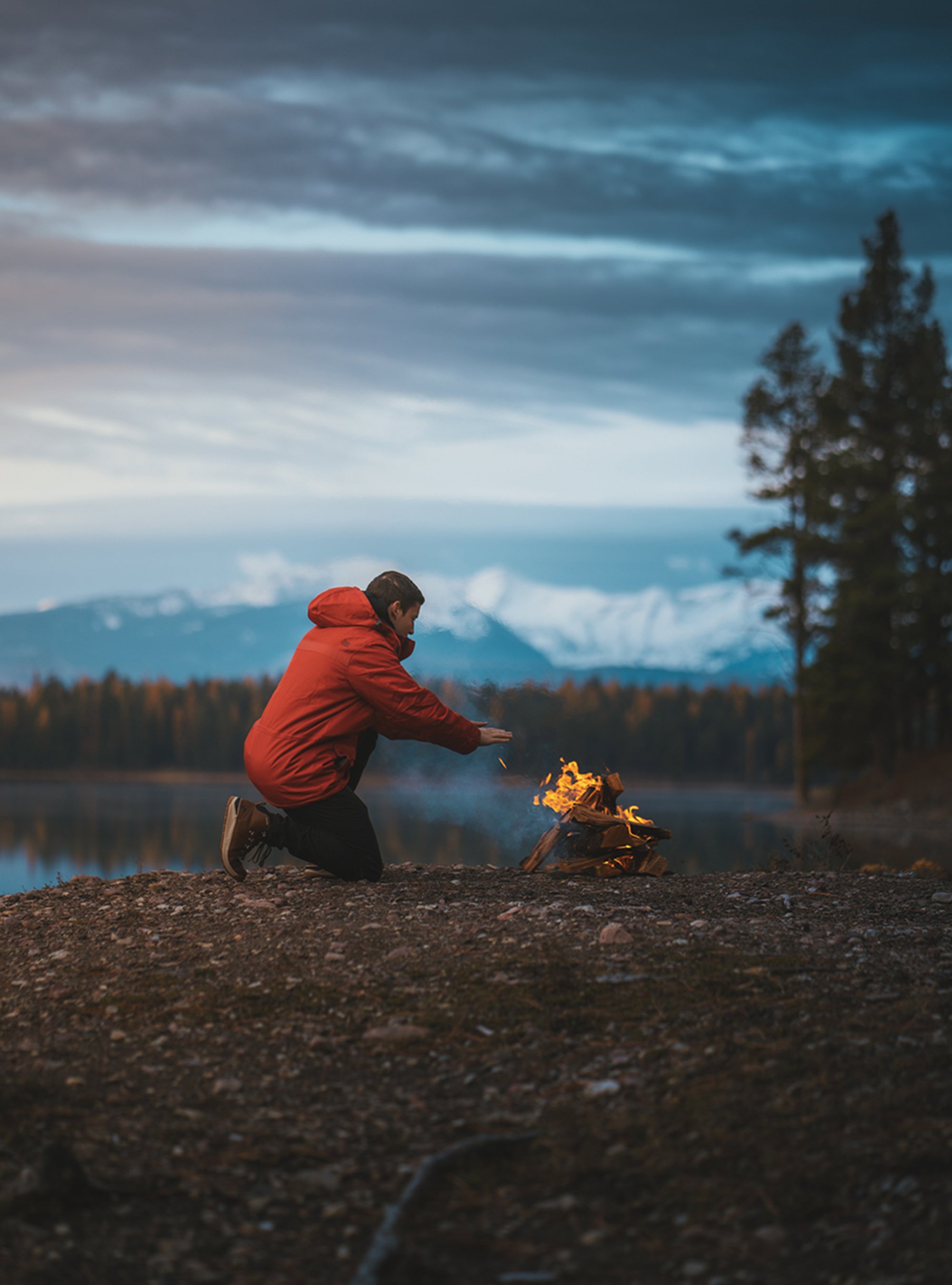 Arctix customer in snow jacket by a fire